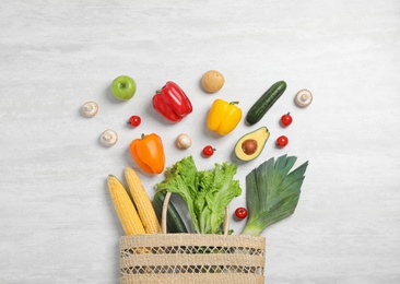 Photo of Fresh vegetables on light grey background, flat lay