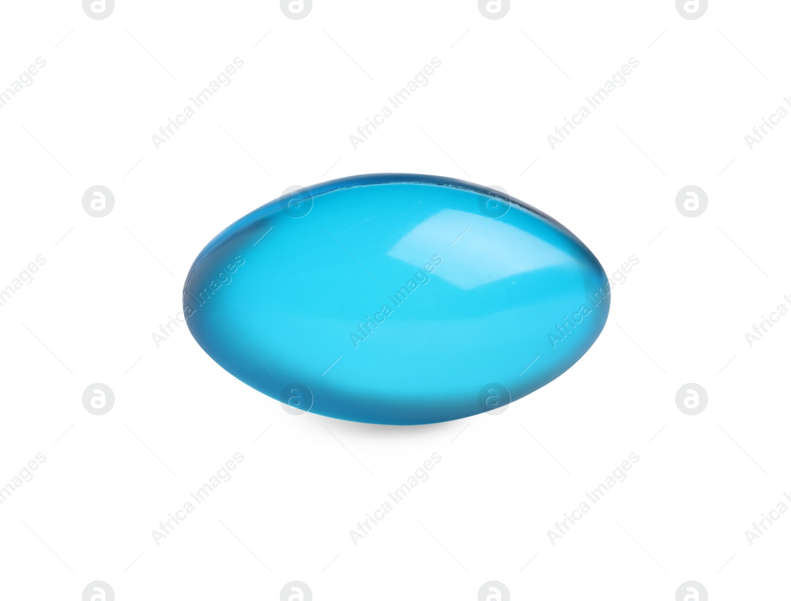 Photo of One light blue pill on white background. Medicinal treatment