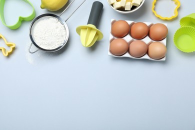 Photo of Cooking utensils and ingredients on light background, flat lay. Space for text