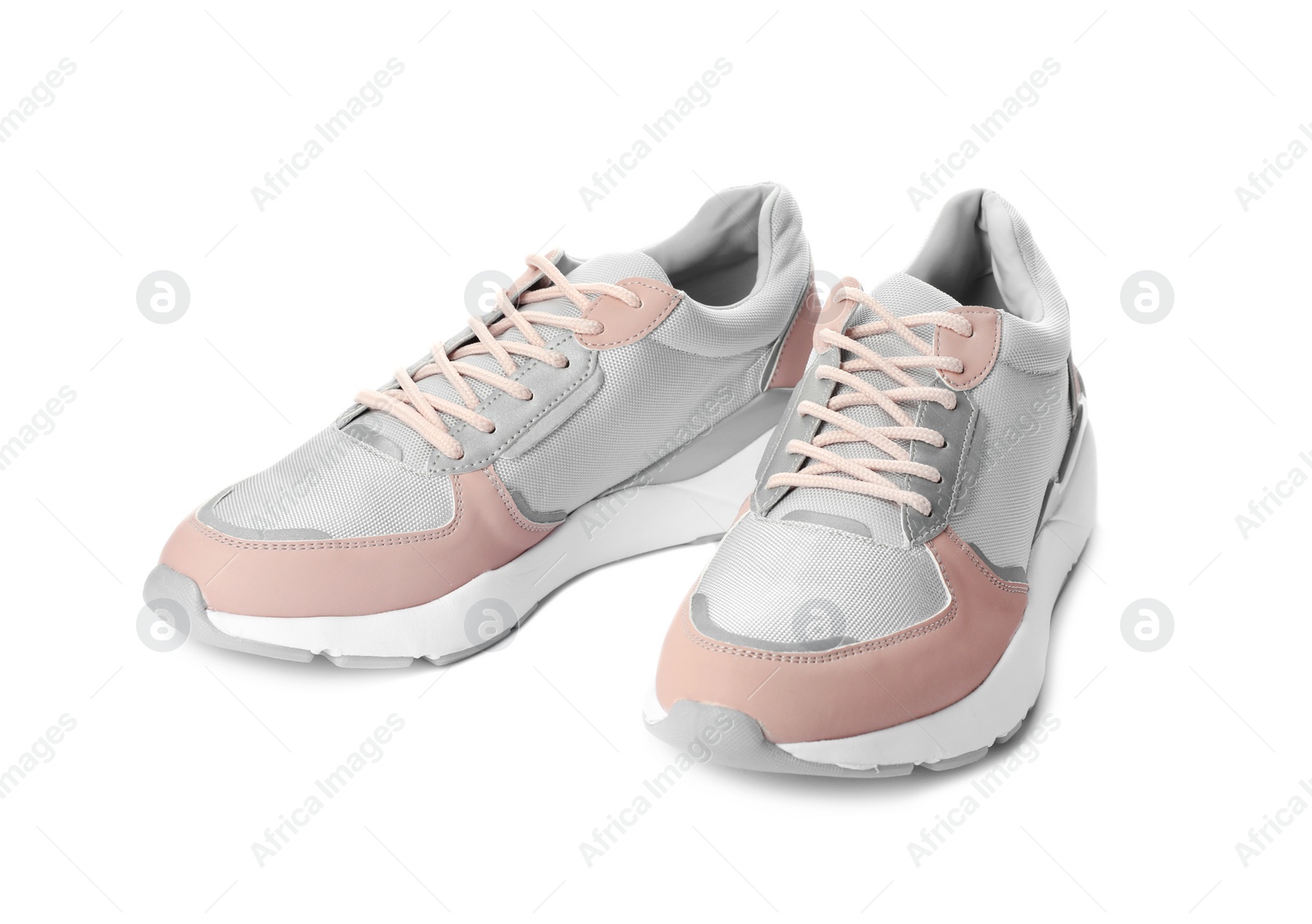 Photo of Pair of stylish sneakers on white background