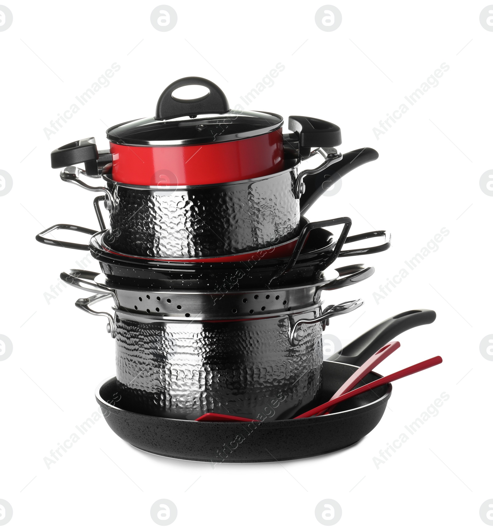 Photo of Stack of clean cookware and utensils isolated on white