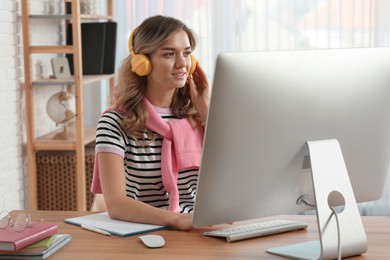 Online test. Woman studying with computer at home