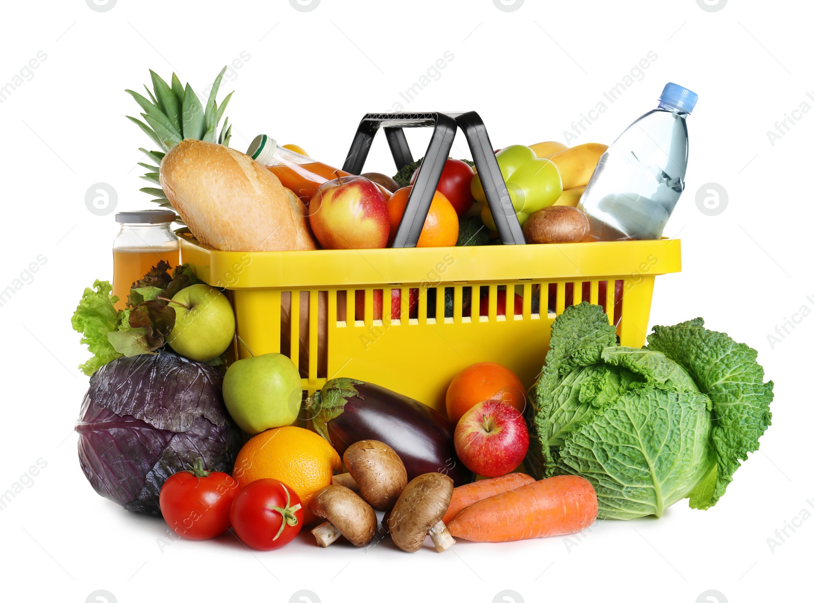 Photo of Shopping basket and grocery products on white background