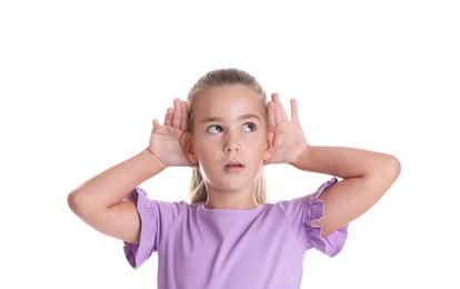 Photo of Cute little girl with hearing problem on white background