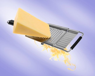 Image of Grating cheese with hand grater on blue background