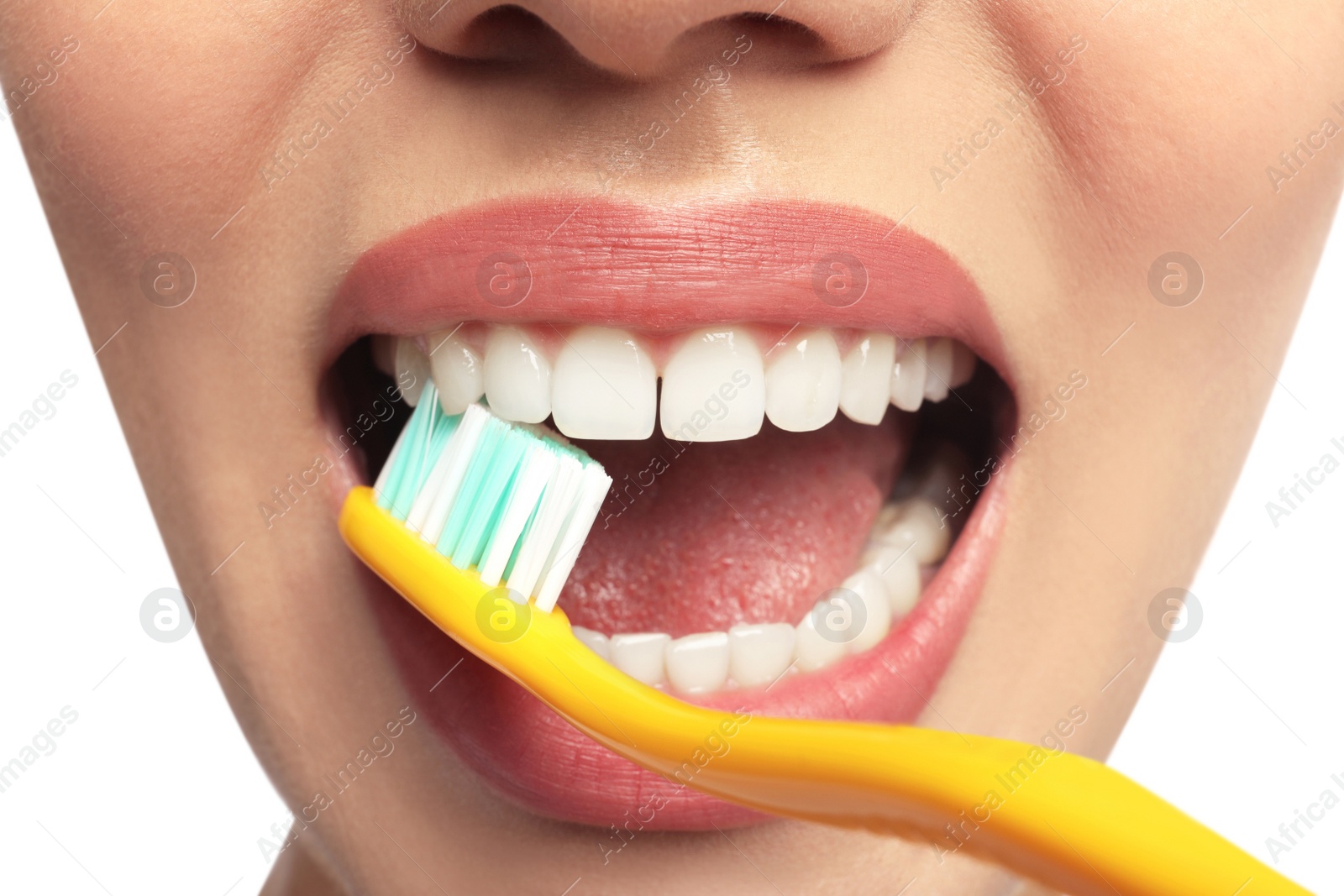 Photo of Woman brushing teeth on white background, closeup. Dental care