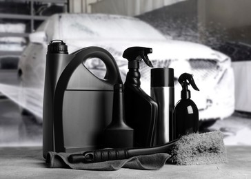Image of Cleaning supplies on grey stone surface at car wash
