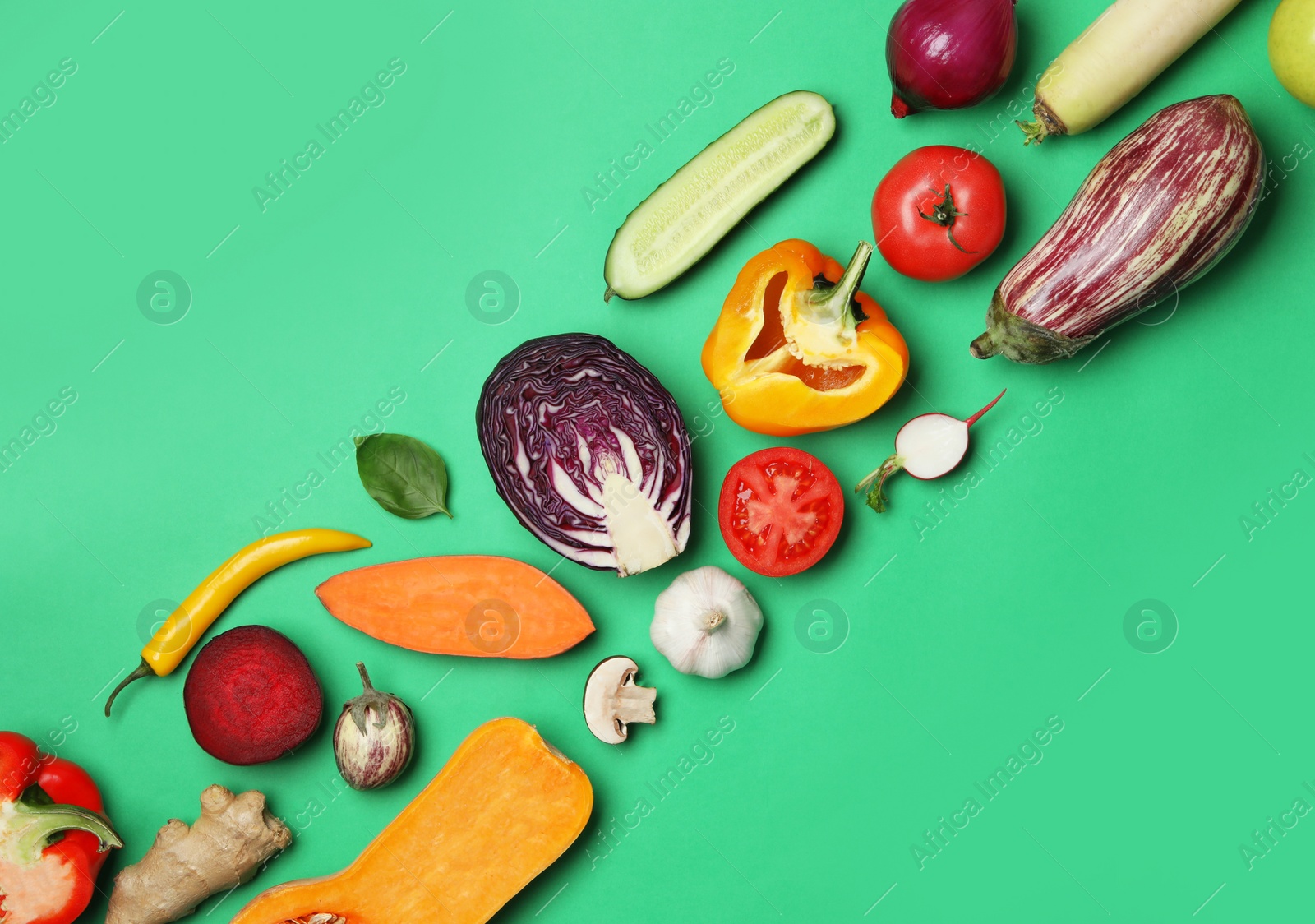 Photo of Flat lay composition with fresh ripe vegetables on color background