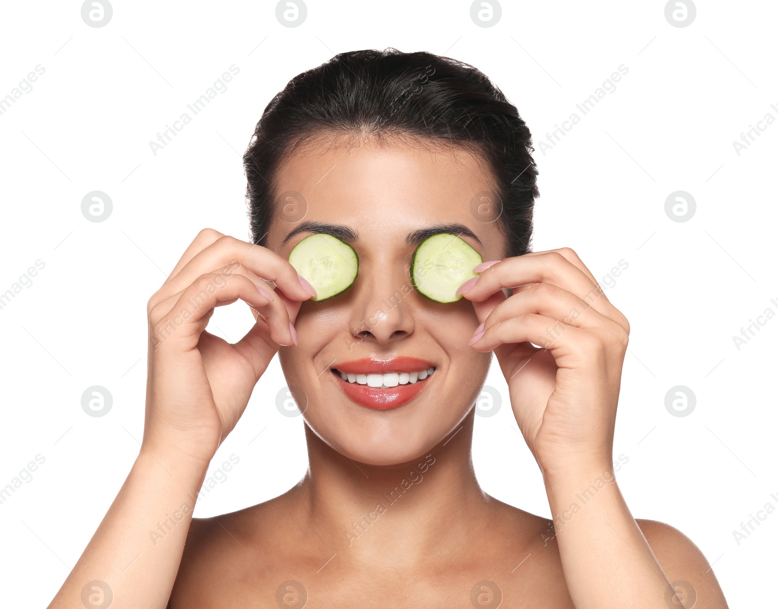 Photo of Woman covering eyes with cucumber slices on white background. Skin care