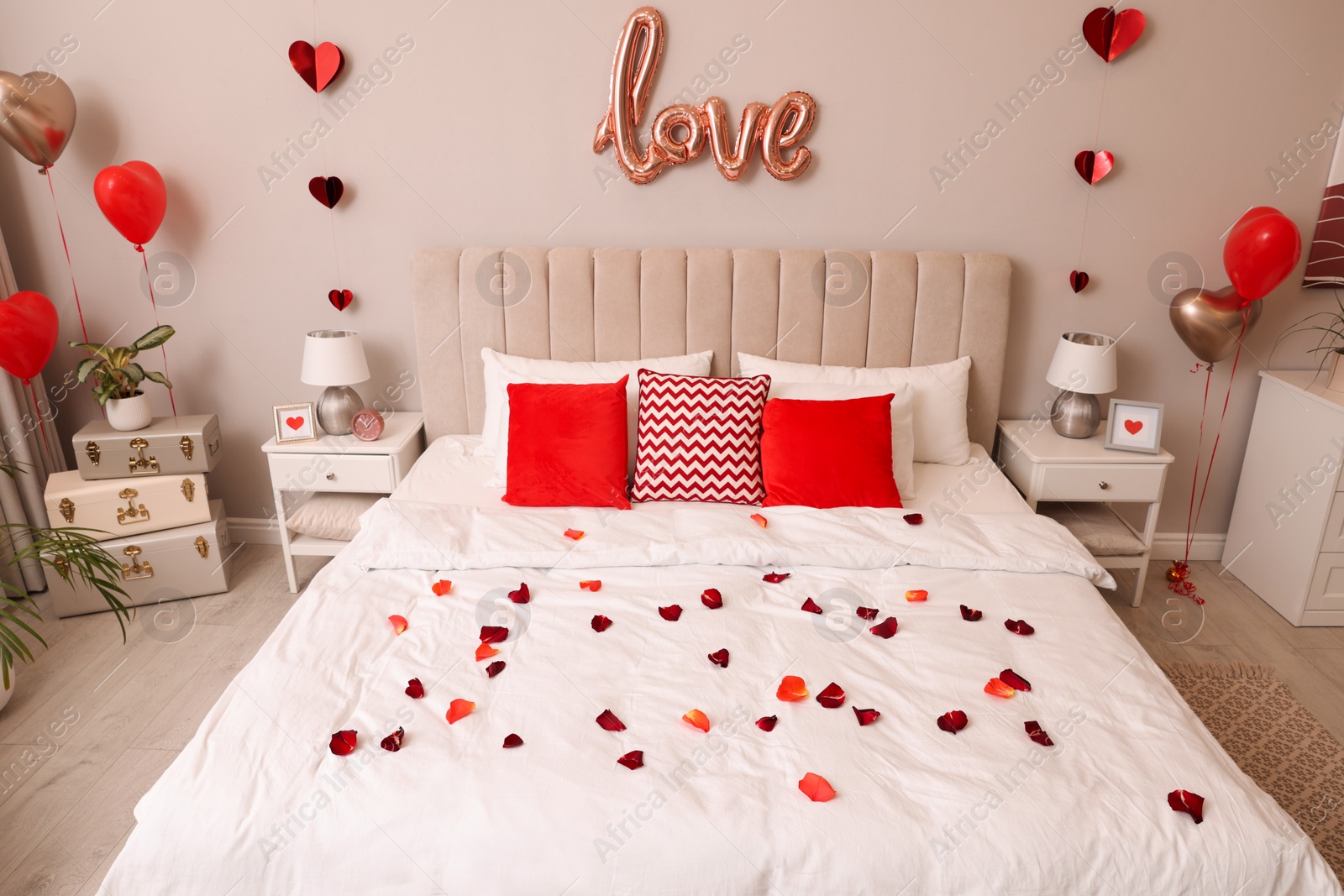 Photo of Cozy bedroom decorated for Valentine Day. Interior design