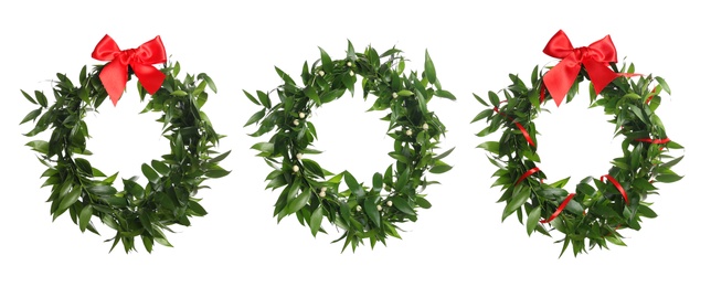 Image of Set with mistletoe wreaths on white background, banner design. Traditional Christmas decor