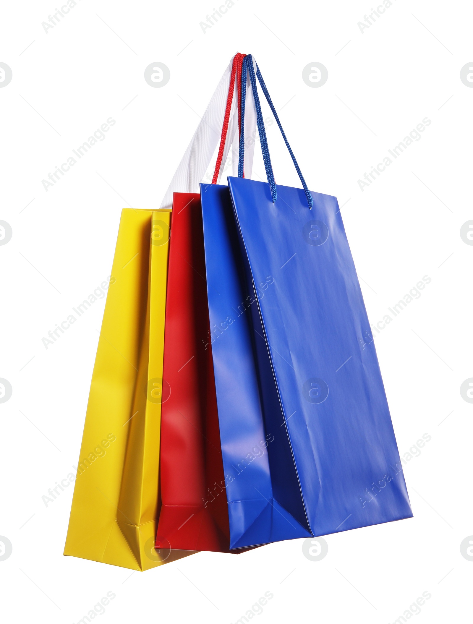 Photo of Colorful paper shopping bags isolated on white