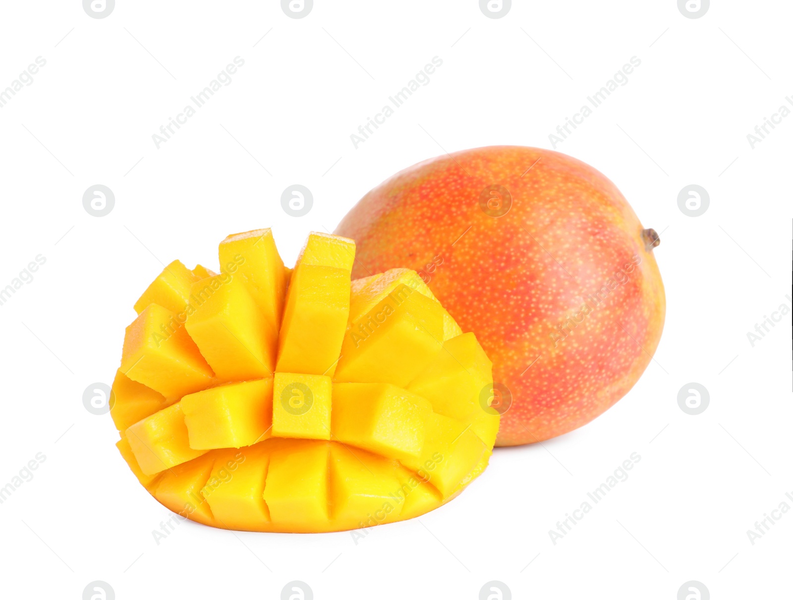 Photo of Delicious whole and cut mangoes on white background