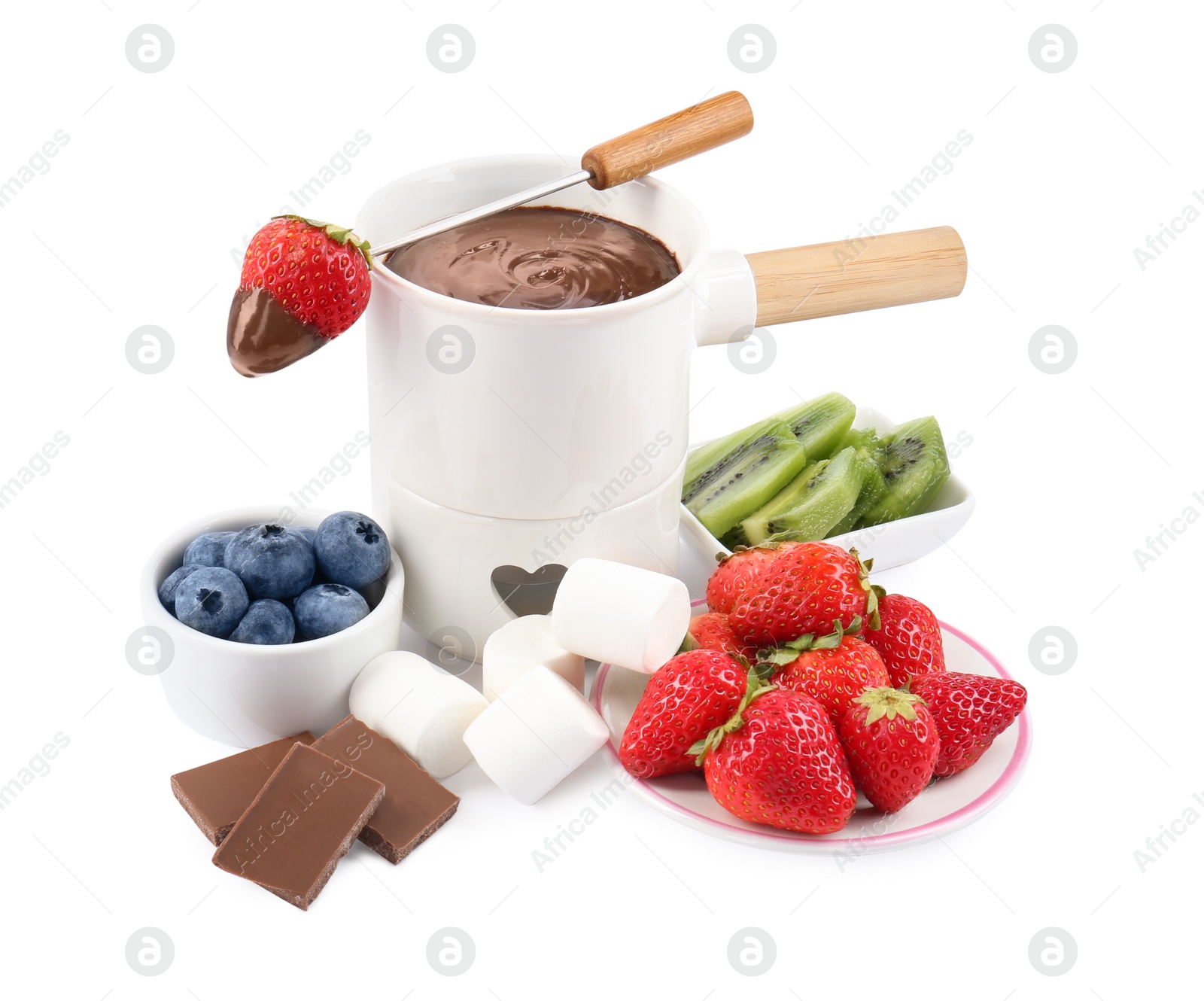 Photo of Fondue pot with melted chocolate, fresh berries, kiwi, marshmallows and fork isolated on white