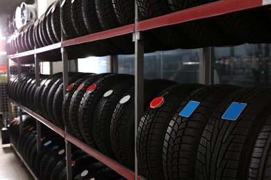 Photo of Car tires on rack in auto store