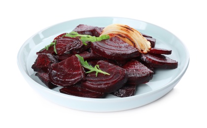 Photo of Plate with roasted beetroot slices, arugula and onion isolated on white