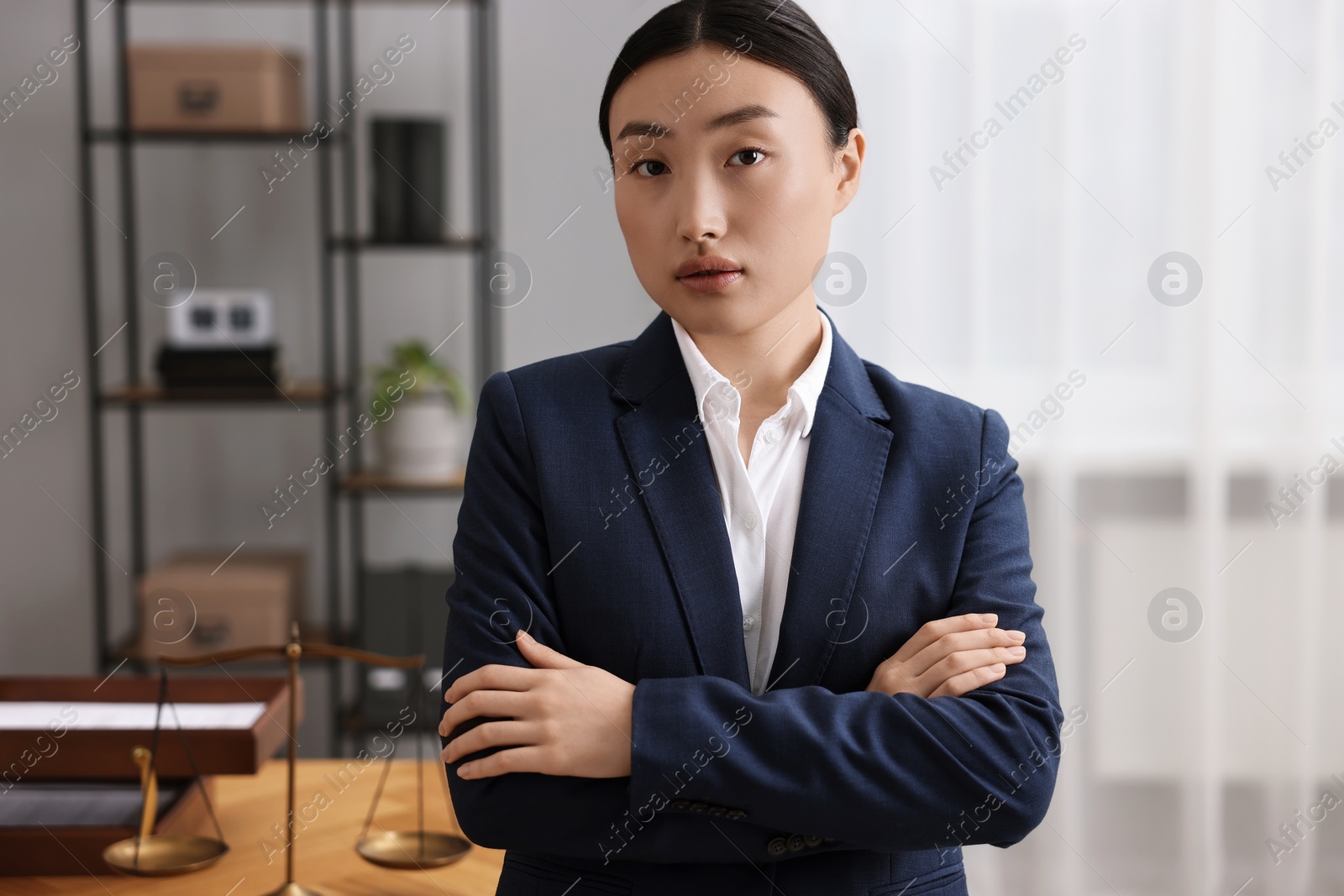 Photo of Portrait of notary with crossed arms in office