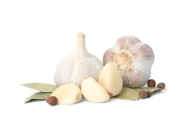 Photo of Fresh garlic bulbs and cloves with seasonings isolated on white. Organic food