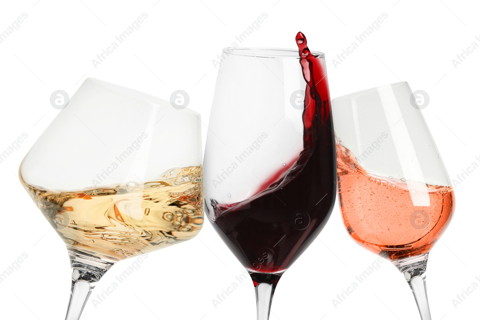 Image of Different types of wine splashing in glasses on white background