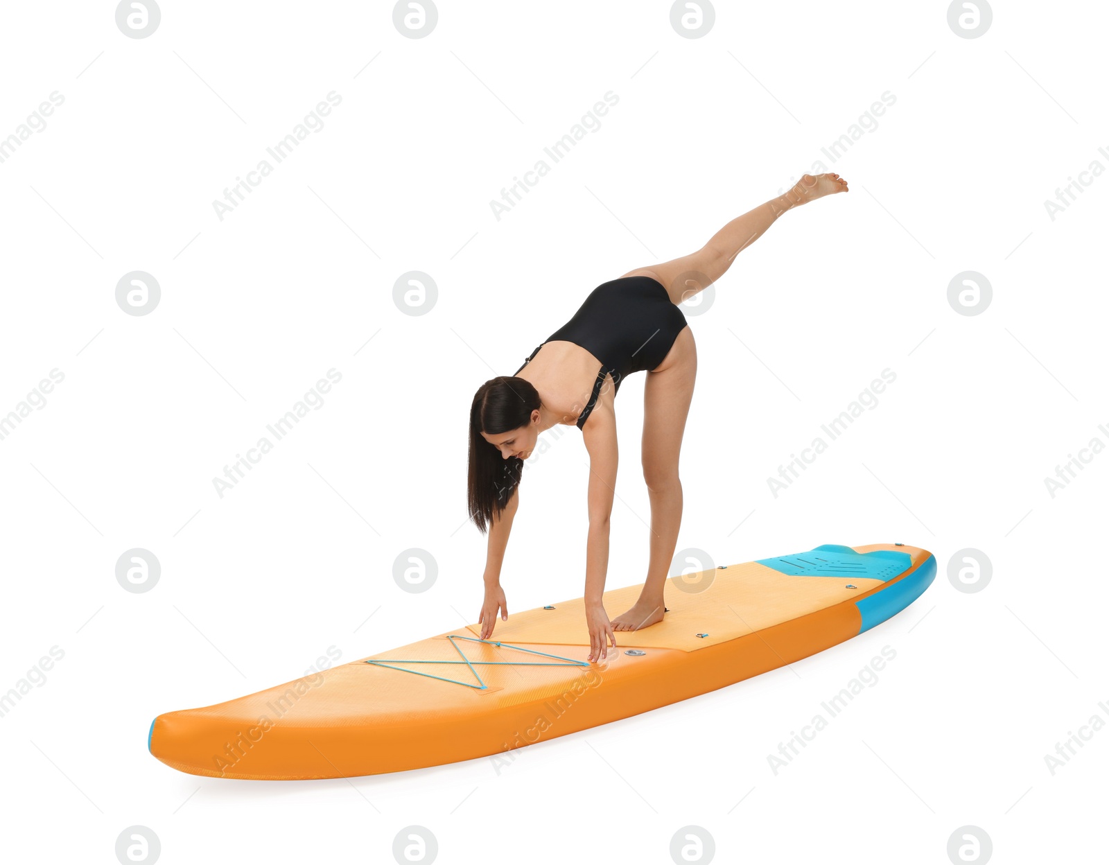 Photo of Woman practicing yoga on orange SUP board against white background
