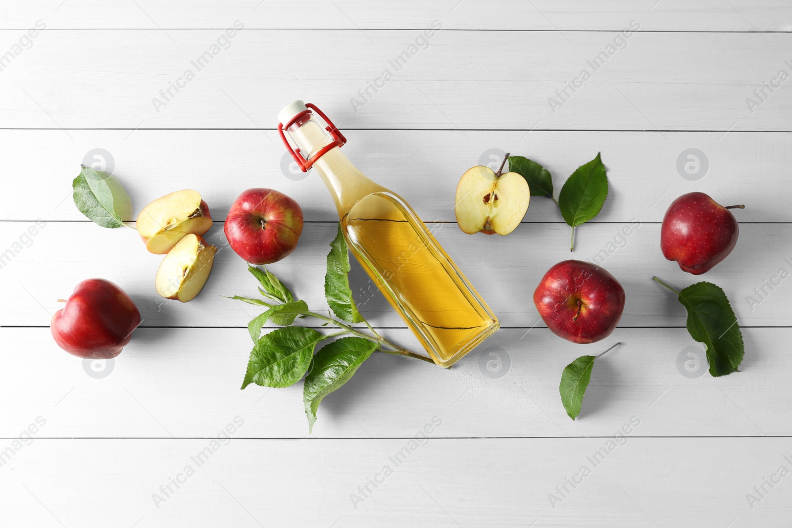 Photo of Flat lay composition with delicious apple cider on white wooden table