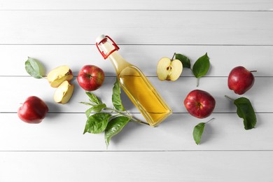 Photo of Flat lay composition with delicious apple cider on white wooden table