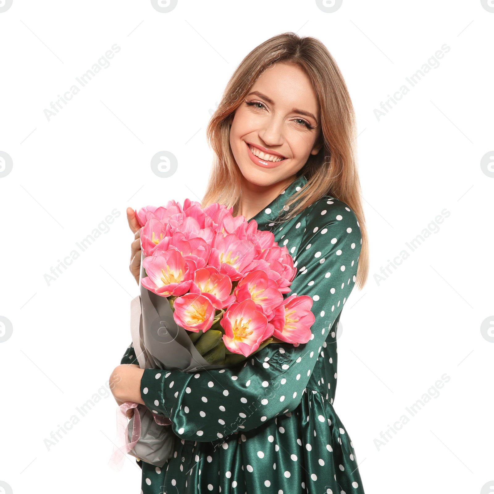 Photo of Portrait of smiling young girl with beautiful tulips on white background. International Women's Day