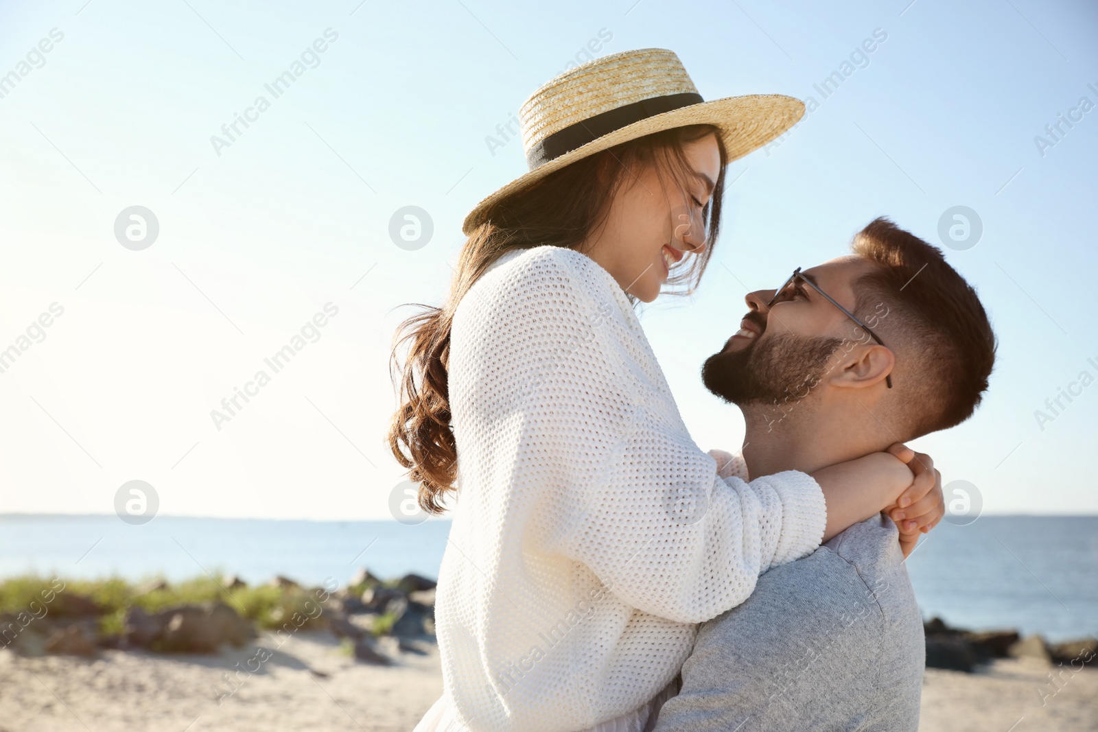 Photo of Happy young couple at beach. Honeymoon trip