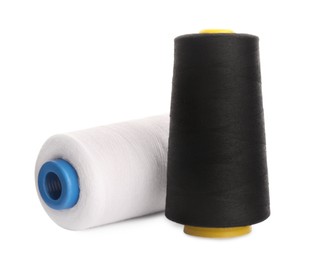 Different colorful sewing threads on white background