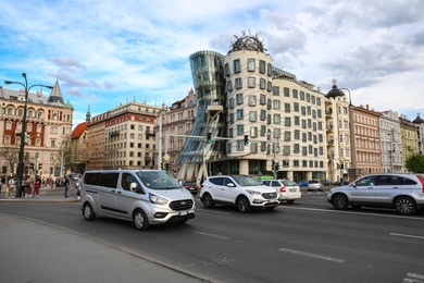 PRAGUE, CZECH REPUBLIC - APRIL 25, 2019: View of city street with road traffic near Dancing House