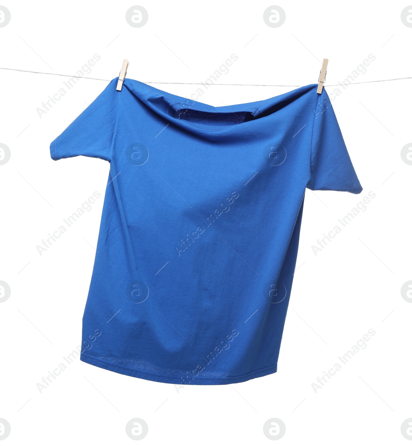 Photo of One blue t-shirt drying on washing line isolated on white