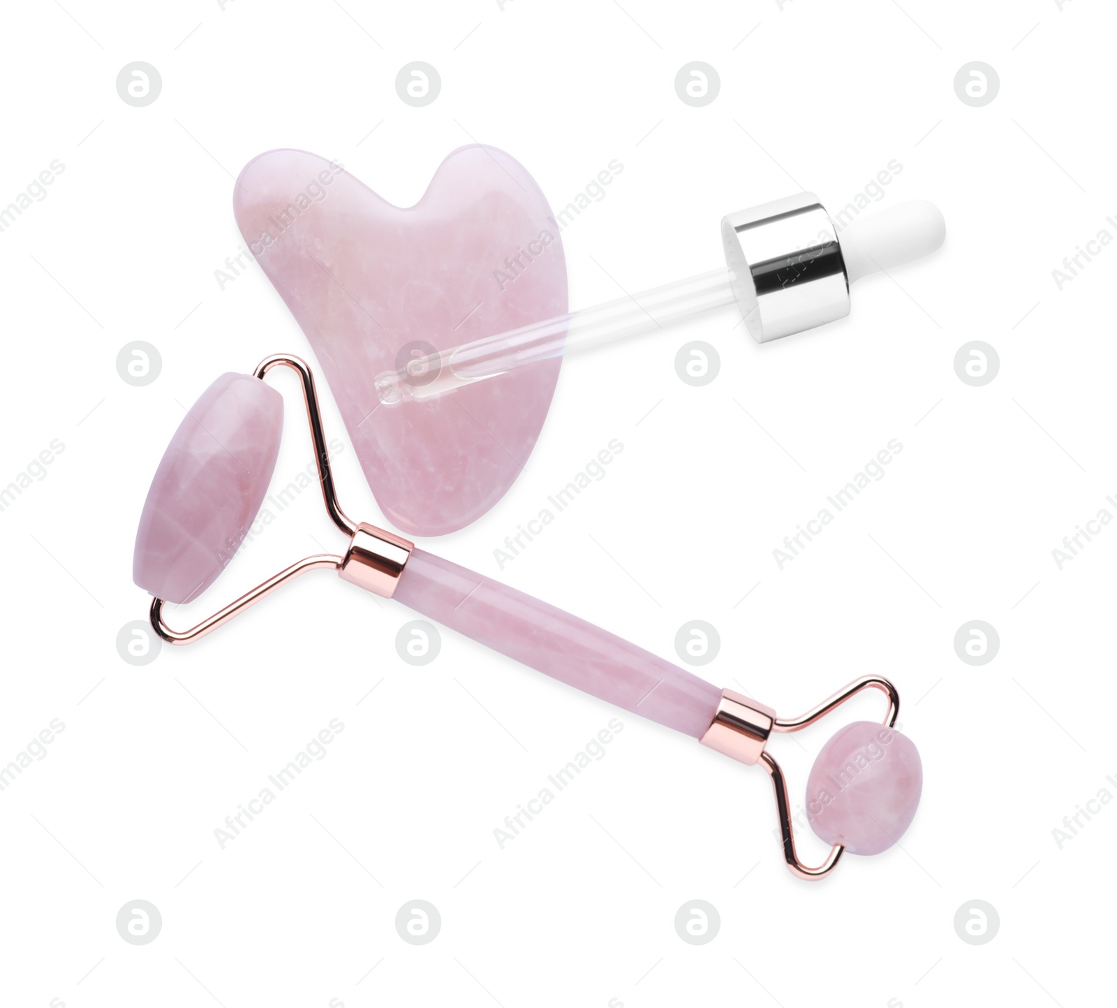 Photo of Rose quartz gua sha tool, facial roller and dropper isolated on white, top view