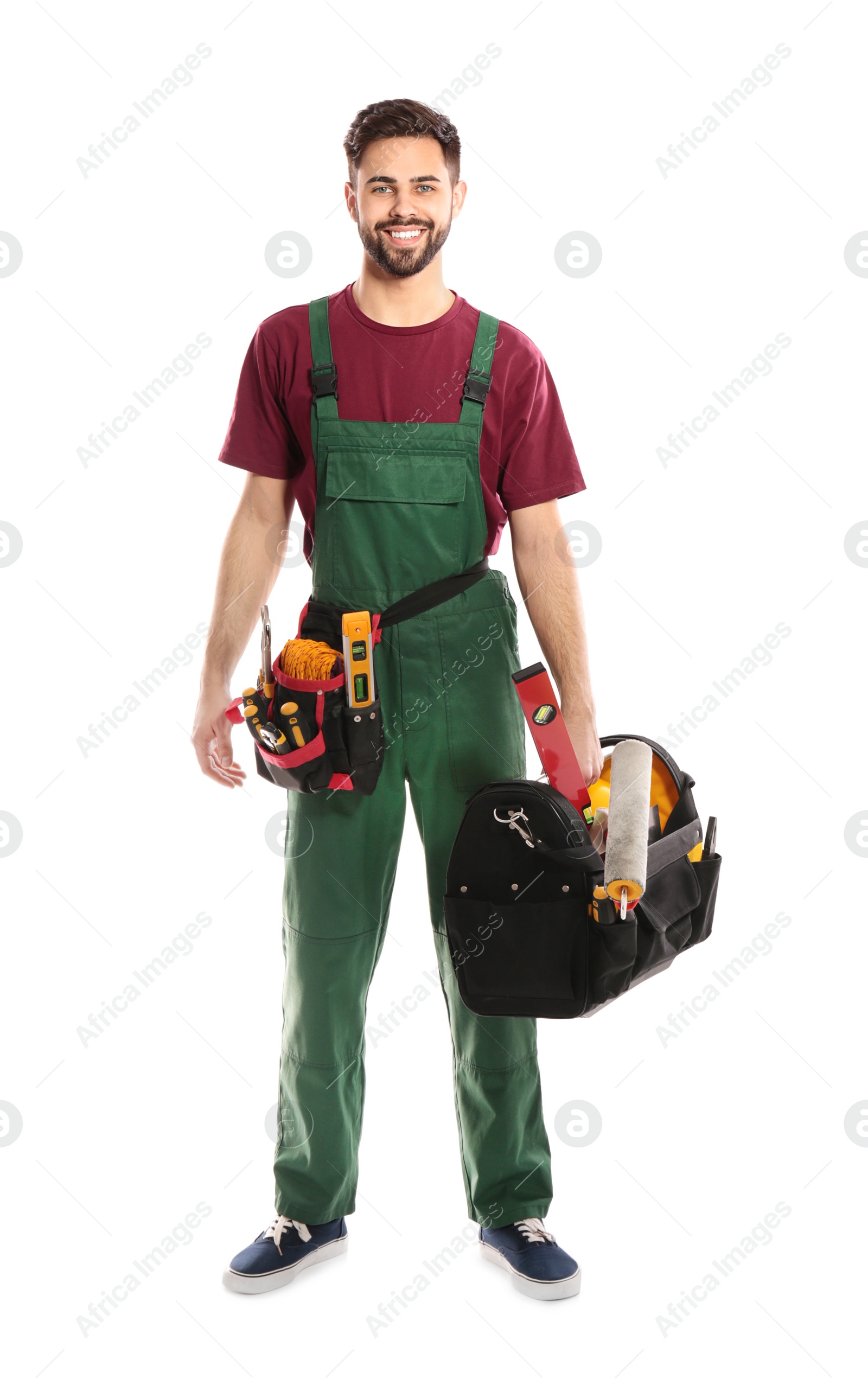 Photo of Full length portrait of professional construction worker with tools on white background