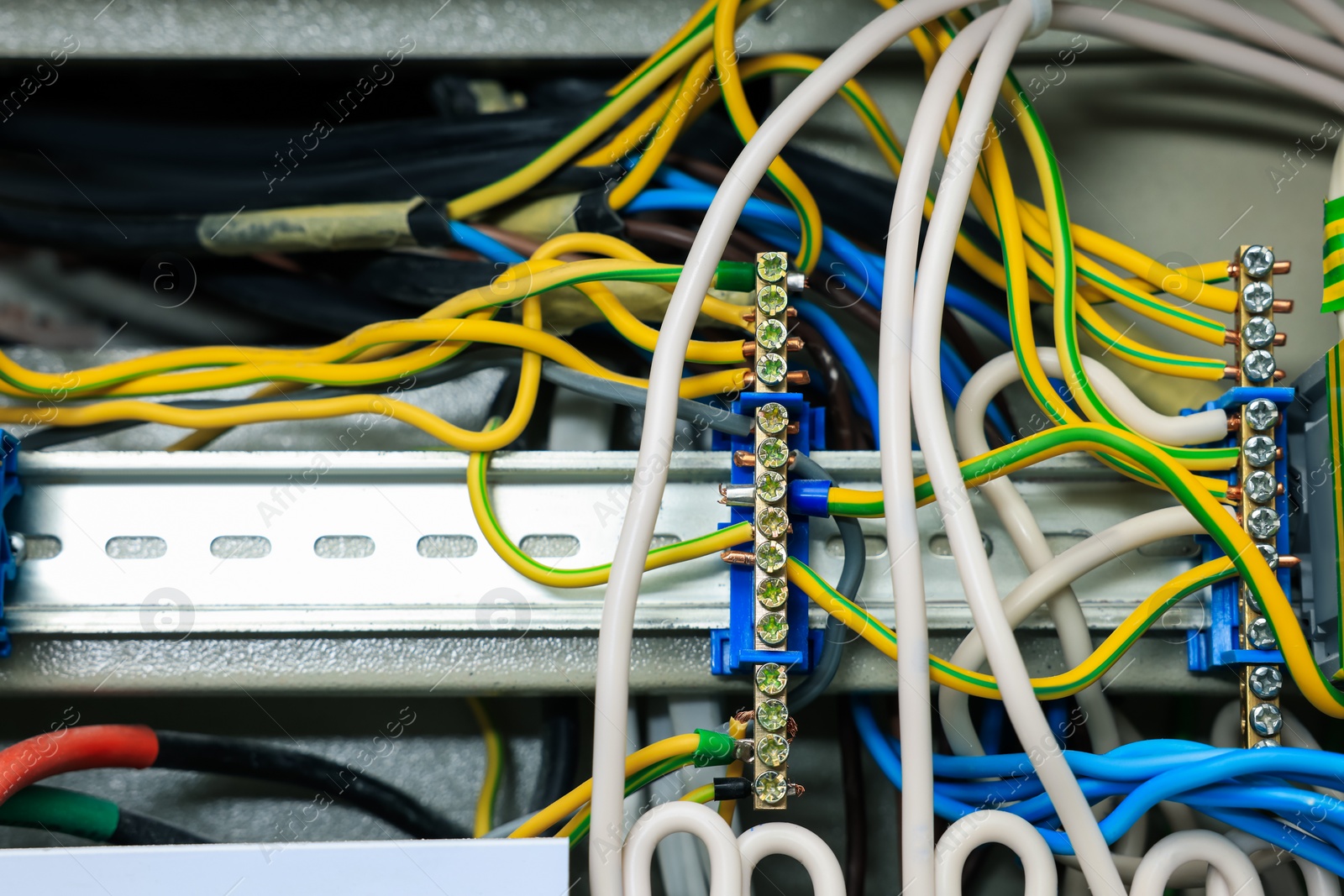 Photo of Electrical panel with many wires in fuse box, closeup