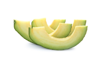 Photo of Slices of ripe avocado on white background