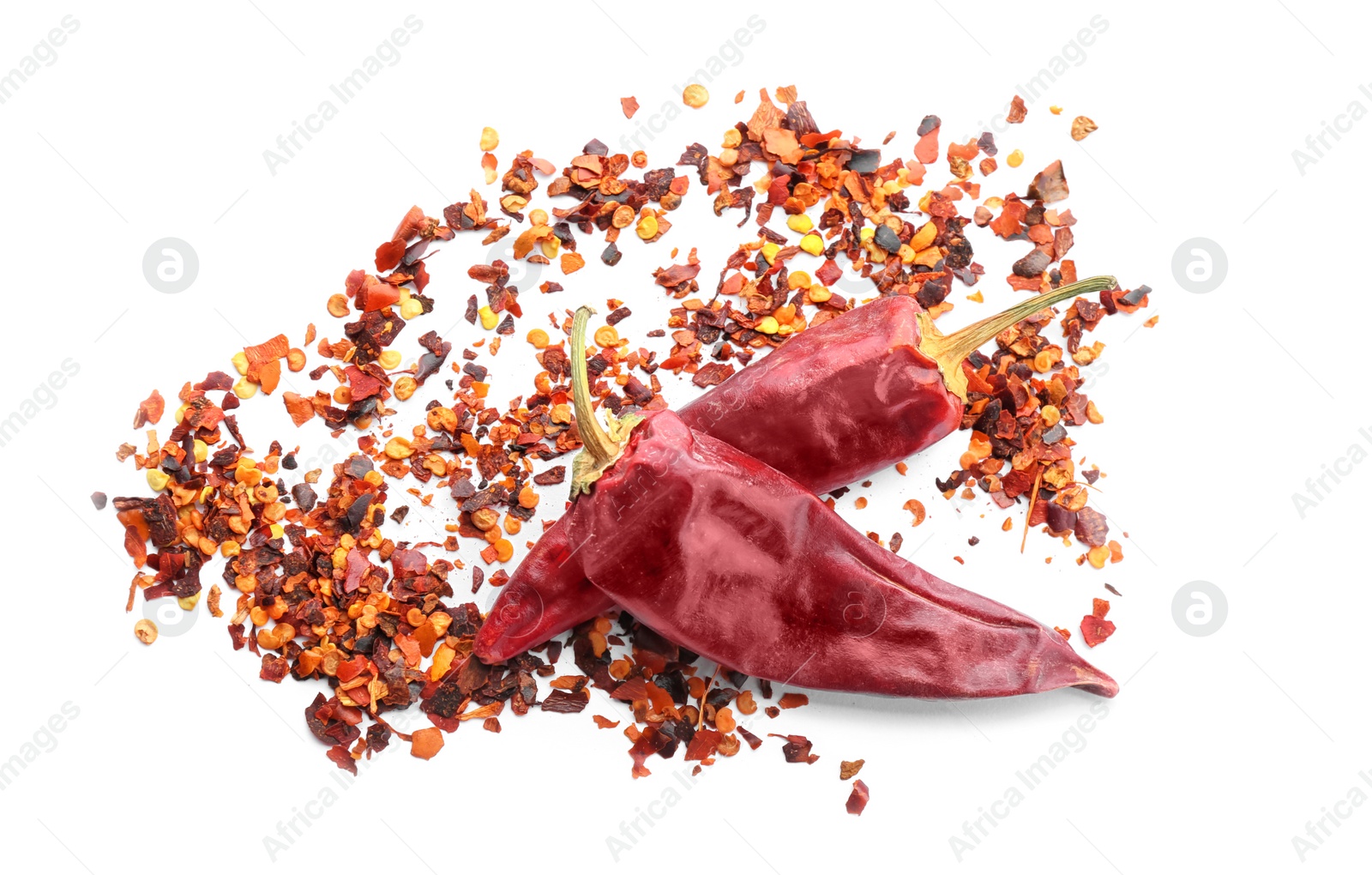 Photo of Composition with chili pepper flakes on white background