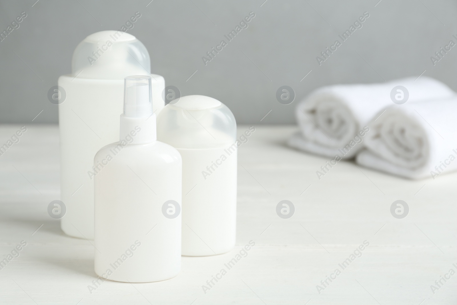 Photo of Different cosmetic products on white wooden table, space for text. Lice treatment