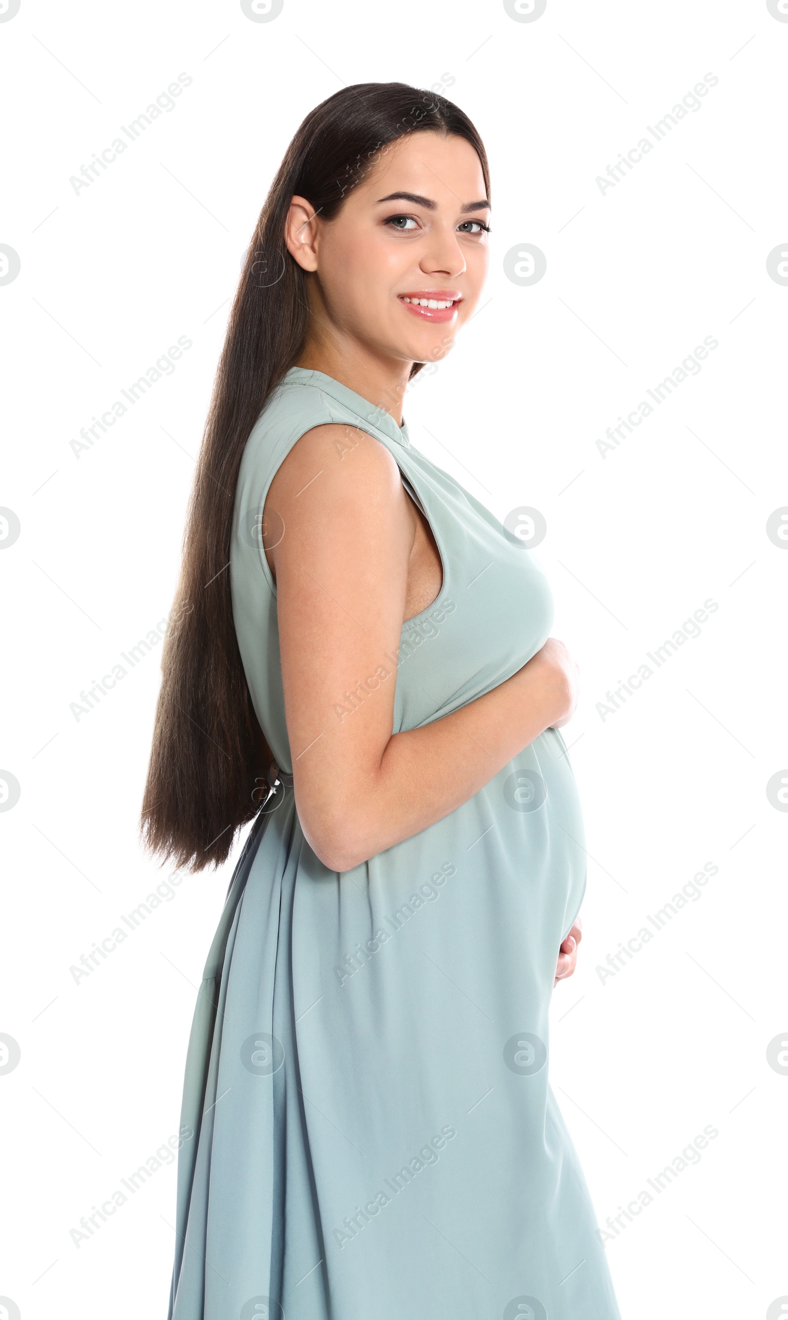 Photo of Portrait of beautiful young pregnant woman in dress on white background