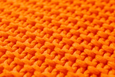 Image of Beautiful orange knitted fabric as background, closeup