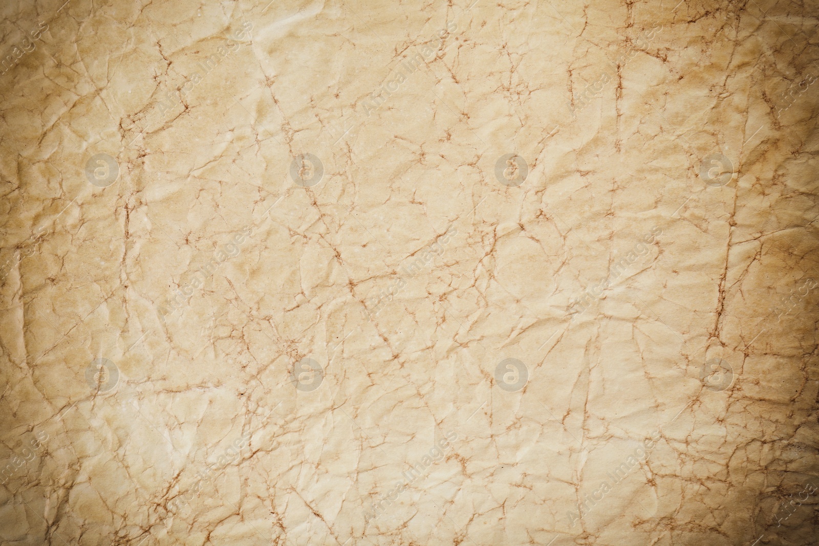 Image of Crumpled old paper as background. Texture of parchment