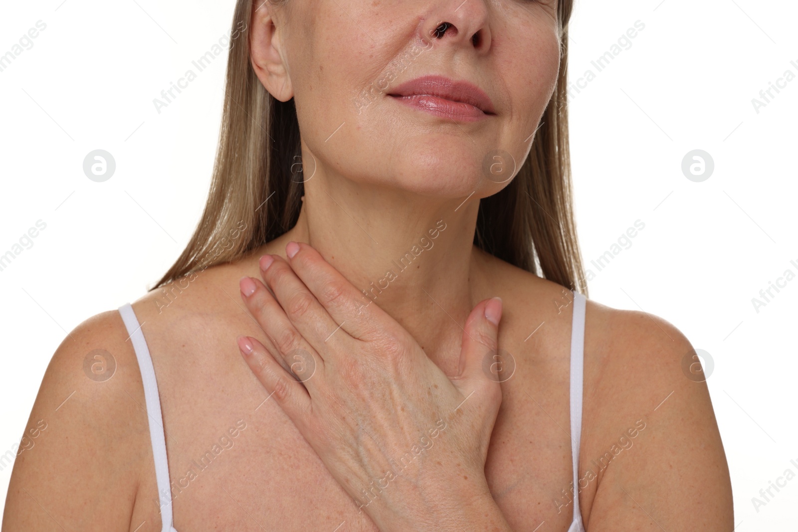 Photo of Mature woman touching her neck on white background, closeup