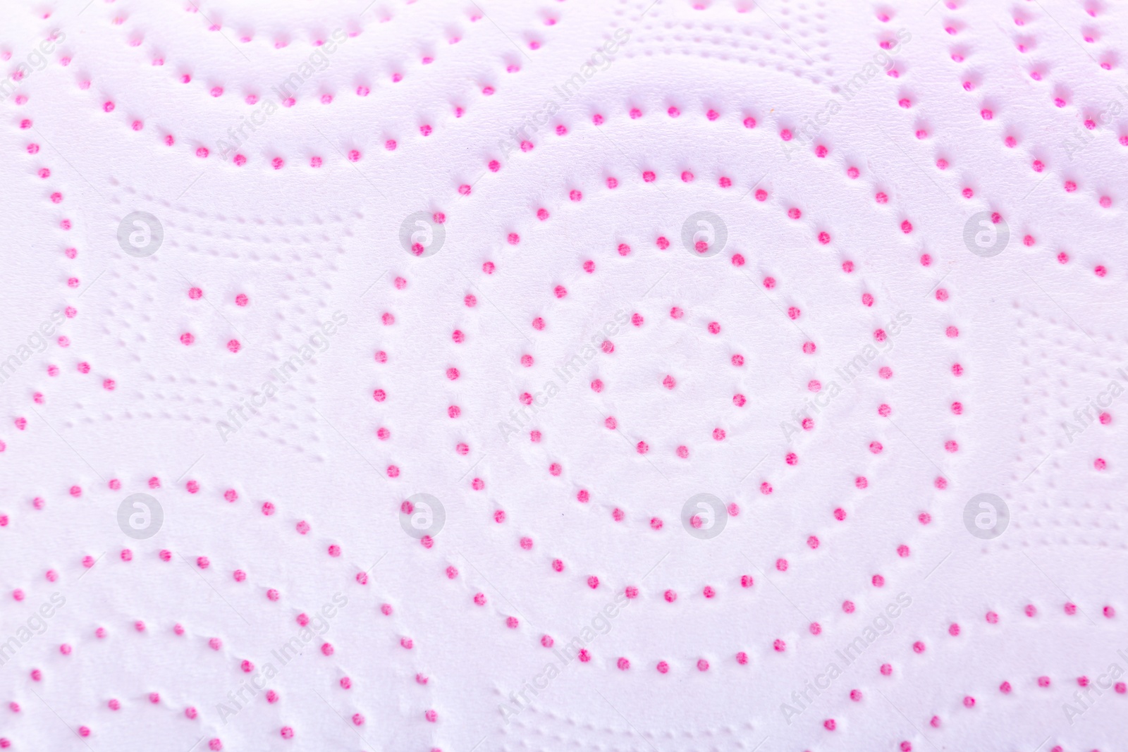 Photo of Perforated toilet paper as background, closeup. Personal hygiene