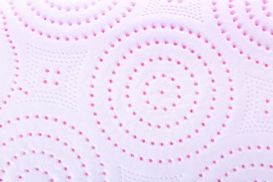 Photo of Perforated toilet paper as background, closeup. Personal hygiene