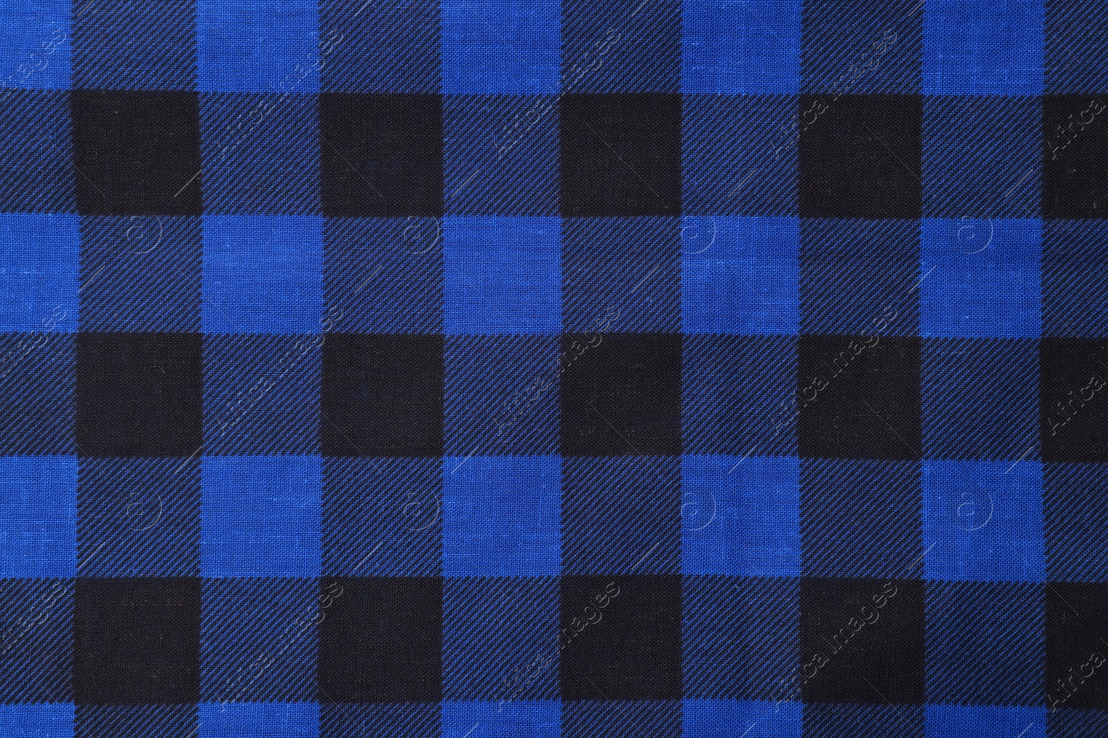 Photo of Top view of blue bandana with check pattern as background