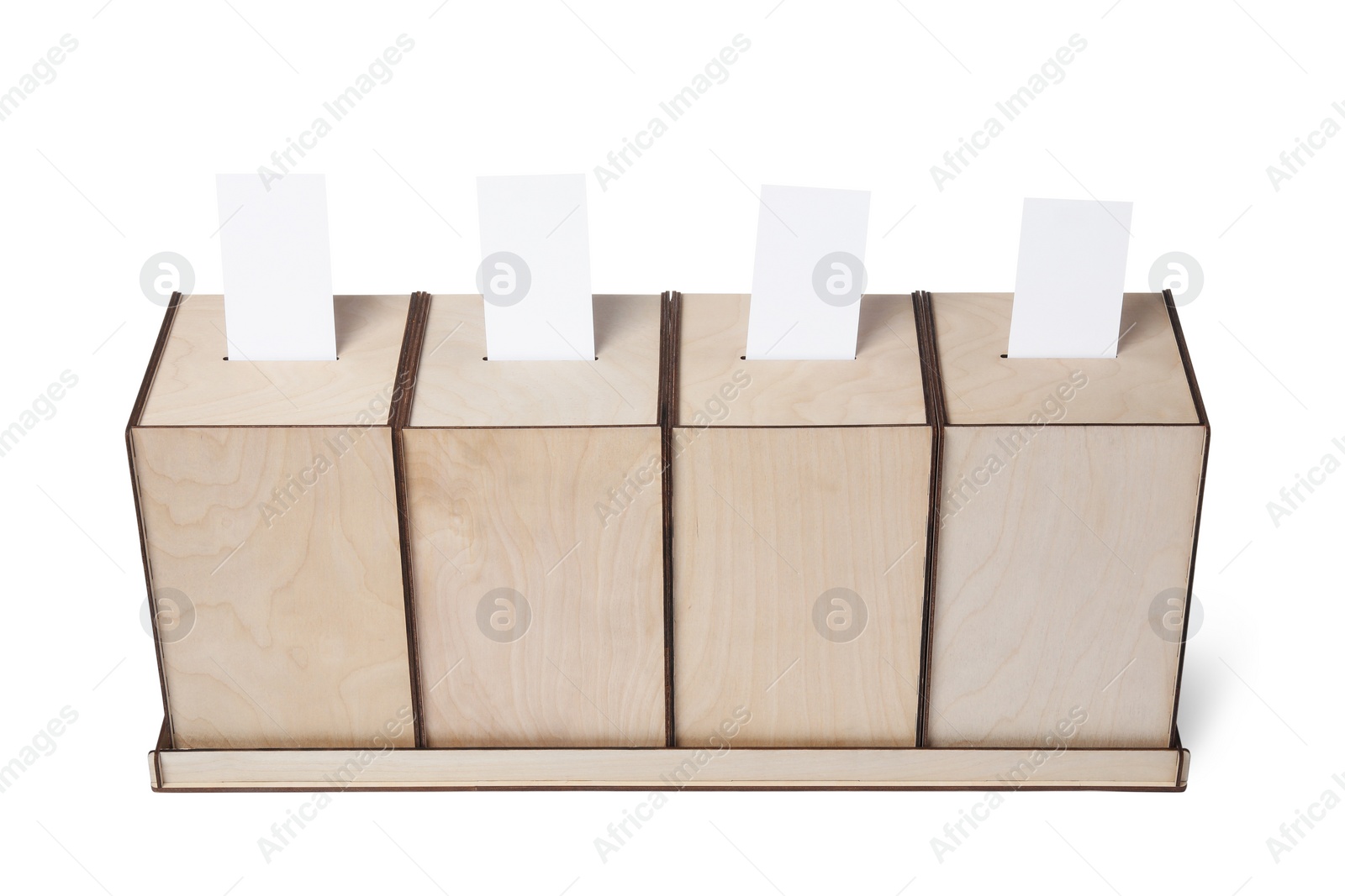 Photo of Wooden ballot boxes with votes isolated on white