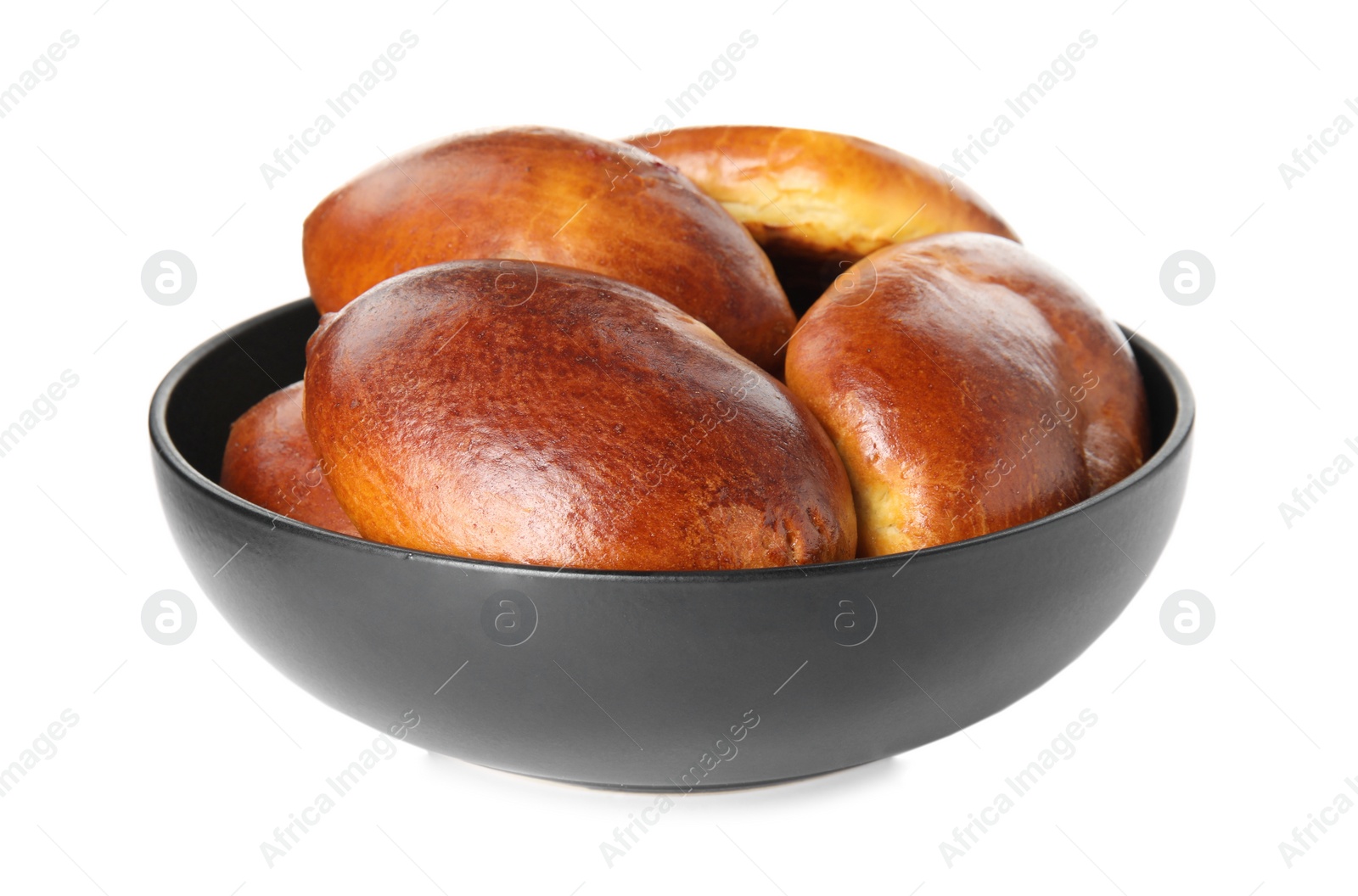 Photo of Bowl with delicious baked pirozhki on white background