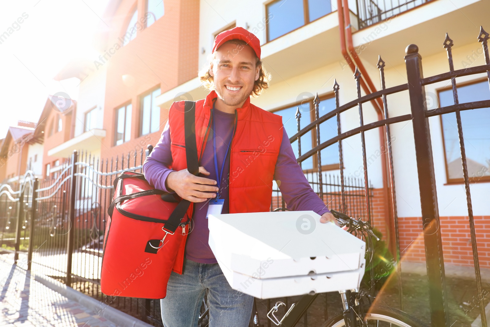 Photo of Male courier delivering food in city on sunny day