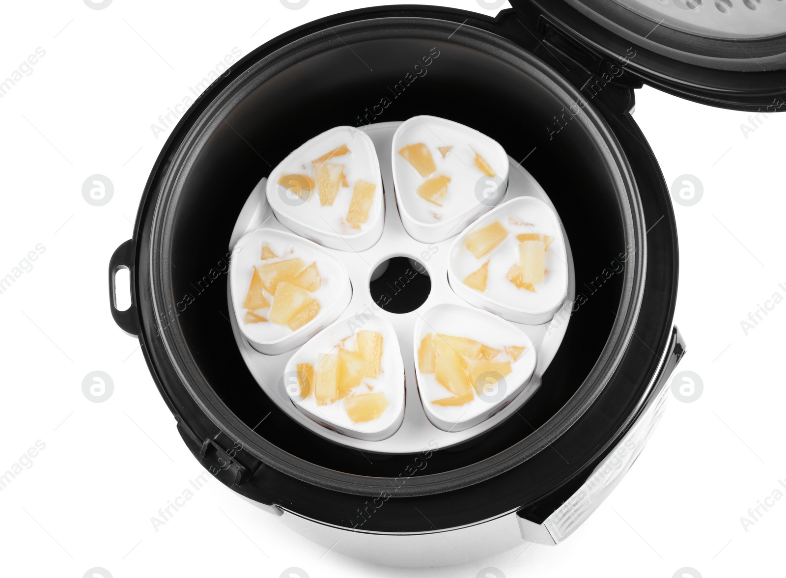 Photo of Cups of pineapple yogurt in multi cooker isolated on white, top view