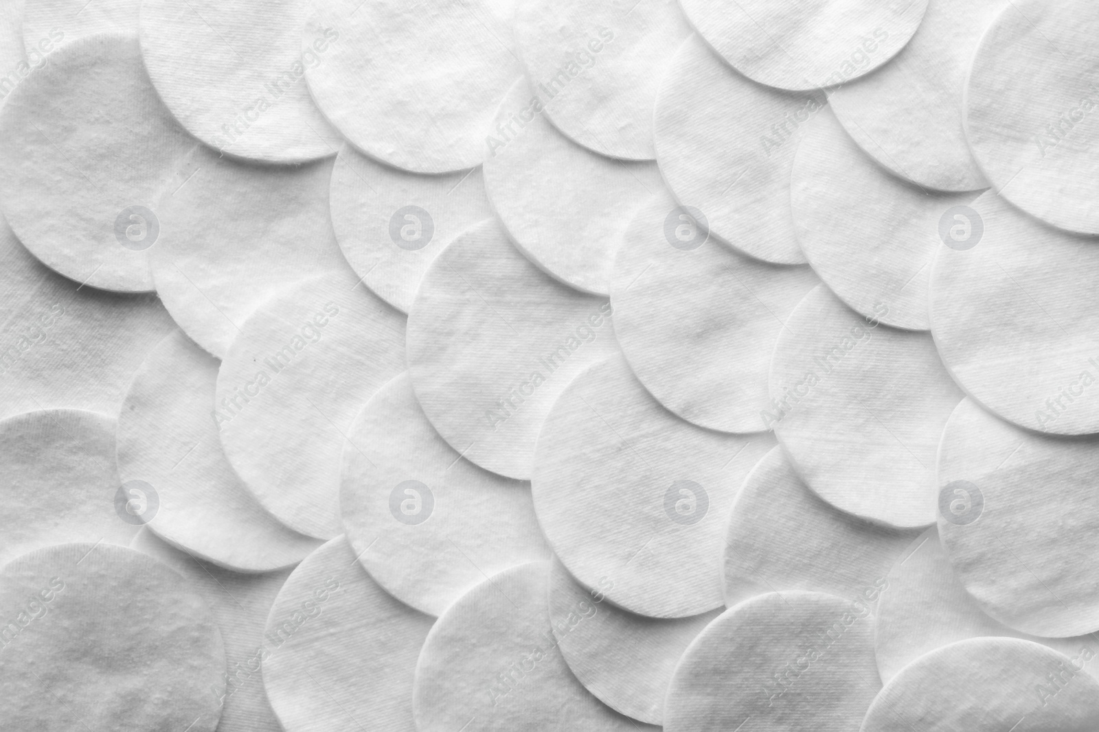 Photo of Many cotton pads as background, top view