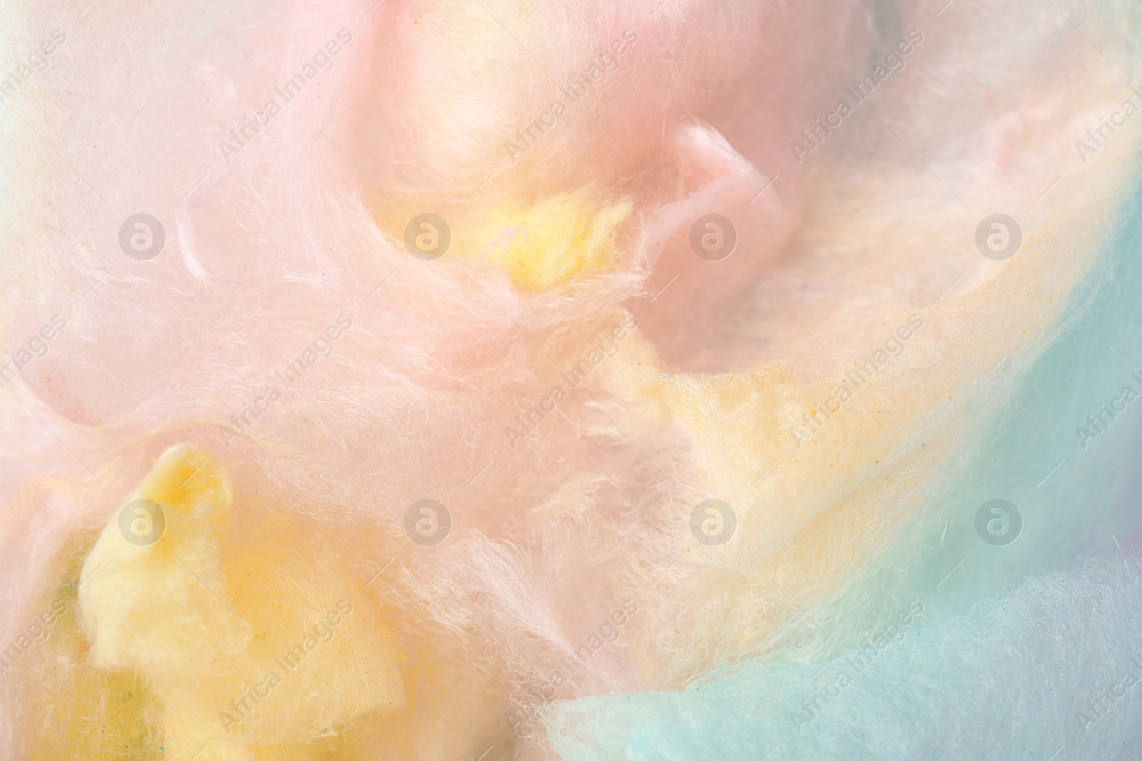 Photo of Sweet colorful cotton candy as background, closeup view